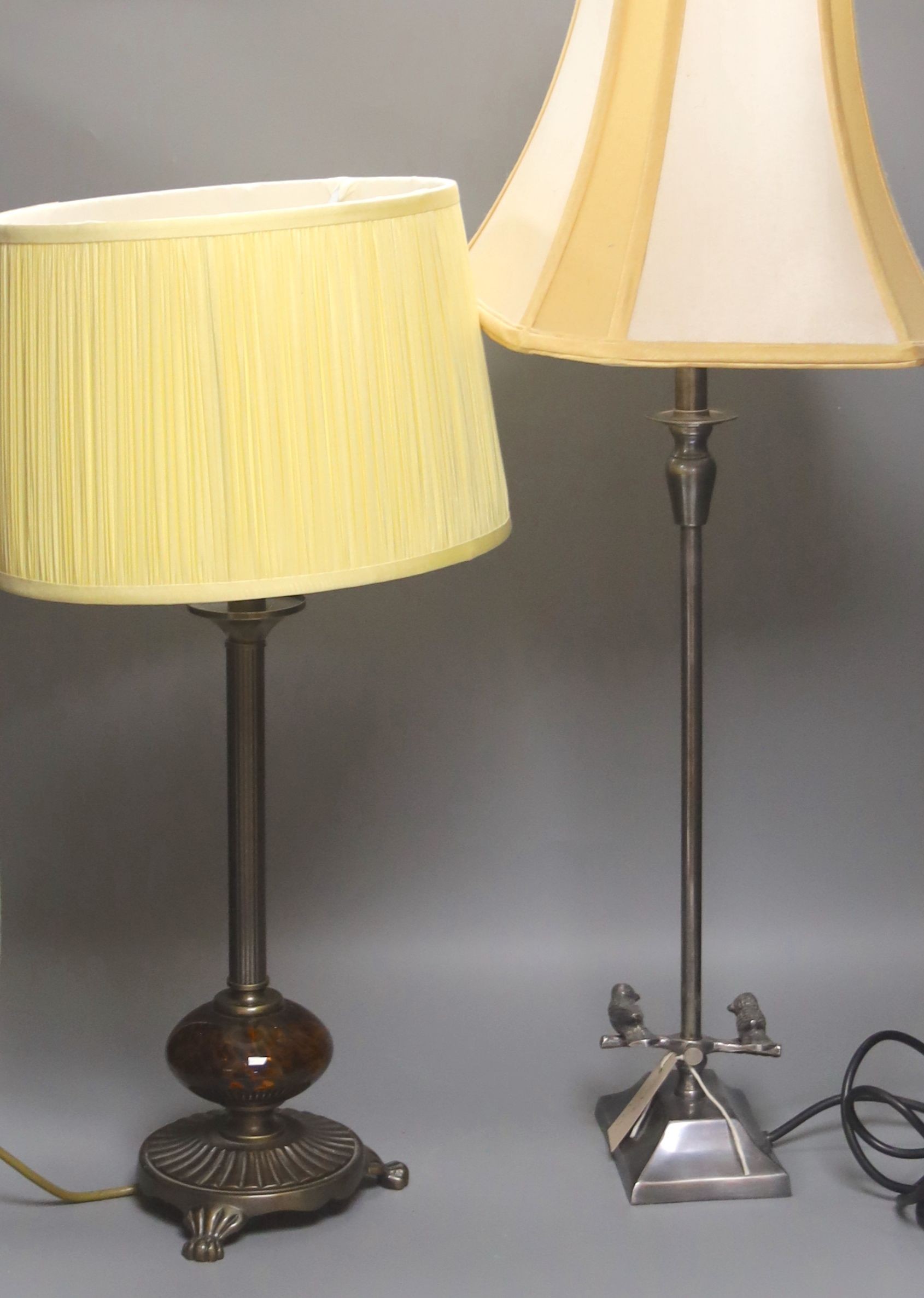 A bronze table lamp with mottled brown glass fitting and a chromed adjustable lamp